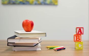 apple, books, blocks and pencils